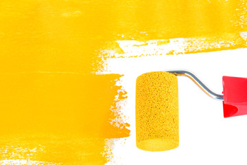 Roller brush with yellow paint