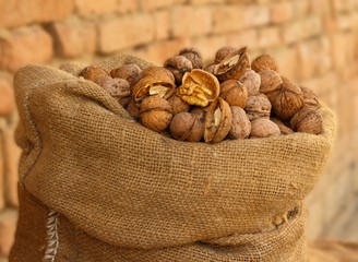 Burlap sack filled with walnuts