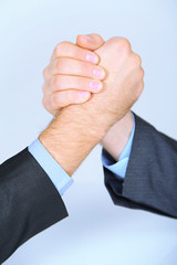 Arm wrestling: business concept isolated on white