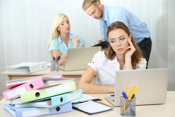 Office staff is during work in workplace