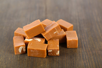 Many toffee on wooden table