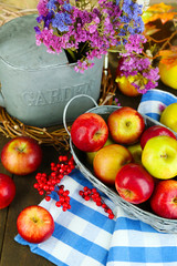Juicy apples in basket on table close-up