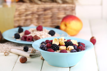 Oatmeal in plates with berries