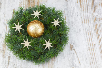 Christmas wreath over old wooden background