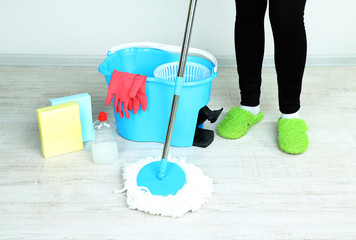 Mopping floor at home close-up