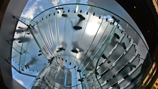 People feet on a circular staircase