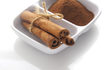 Cinnamon over white background