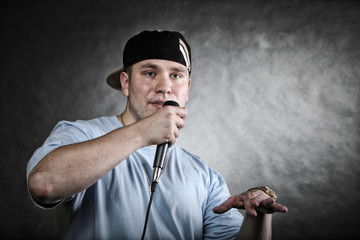 Rap singer man with microphone cool hand gesture