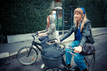 Fototapeta na wymiar two friends woman on bike