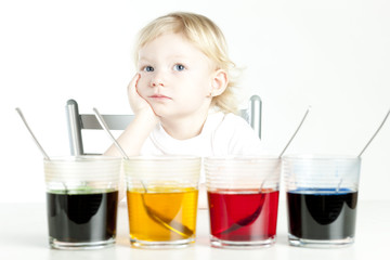 little girl during Easter eggs'' coloration