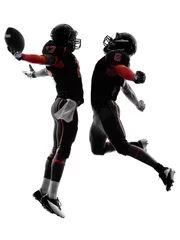 Fotobehang two american football players touchdown celebration silhouette © snaptitude