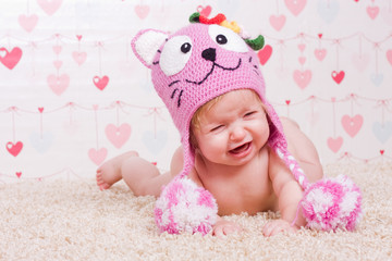 Crying baby with hat