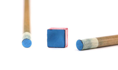 Cue sticks with chalk block.