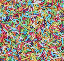 Fototapeta na wymiar Colored sugar sprinkles decoration.