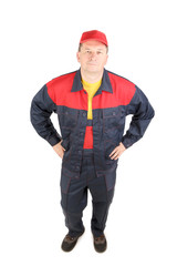 Worker in workwear and red cap.