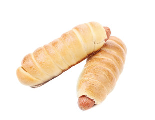 Close up of baked hot dogs.