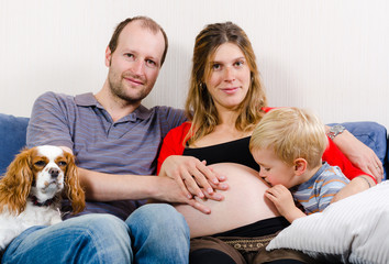 Obraz na płótnie Canvas Happy family expecting new baby