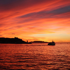 Fototapeta na wymiar Cruise ship in port of Marseille at sunset - France