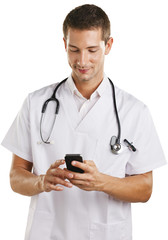 Young doctor man with stethoscope sending a message. Isolated.