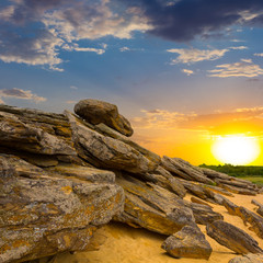 Fototapety  kamienista pustynia o zachodzie słońca