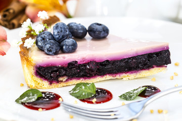 piece of blueberry pie on a table in a restaurant
