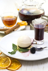 dessert, a piece of cake on the table with a cup of tea