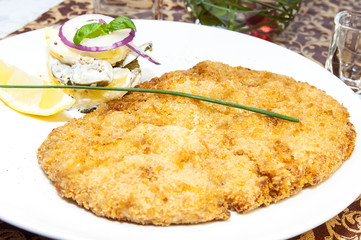 Schnitzel vegetable salad at restaurant