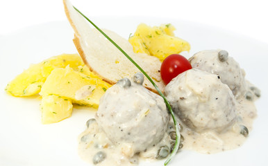meatballs with potatoes on the table in a restaurant