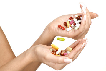 close up of female hands with a lot of pills