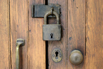 Fototapeta premium old lock on wood door, security abstract