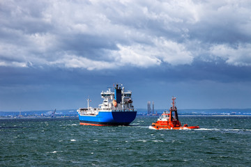 Fototapeta premium Ship at sea against a dramatic sky