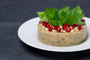 white bean pate with nuts and pomegranate seeds