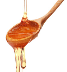 Honey dripping from a wooden honey dipper isolated on white back