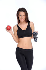 Cute young lady holding red apple while isolated on white..