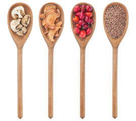 Spoons with flax, mushrooms, wild rose, apple