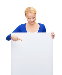 woman in casual clothes with blank white board