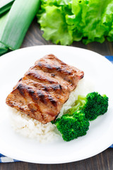 Grilled ribs with rice and broccoli