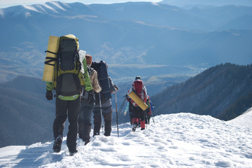 hikers in a winter mountain
