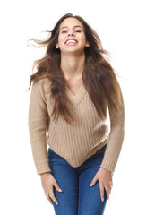 Young woman laughing with hair blowing