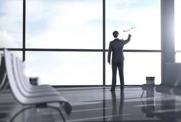 businessman holding plane