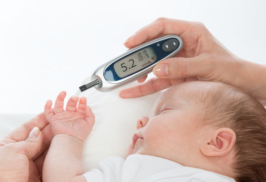 measuring glucose level blood test  child baby