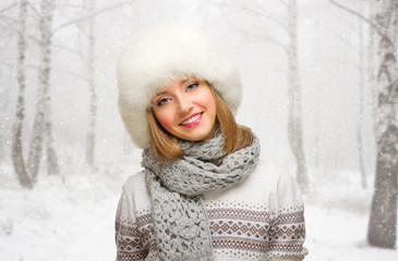 Young girl on snowy forest