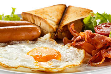 English breakfast - toast, egg, bacon and vegetables