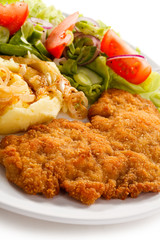 Fried pork chops, boiled potatoes and vegetable salad