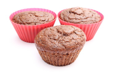 Fresh baked chocolate muffin in red silicone cups