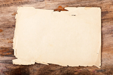 Paper on old wooden background