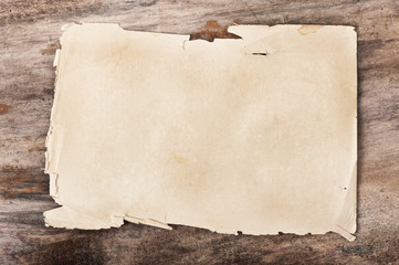 Paper on old wooden background