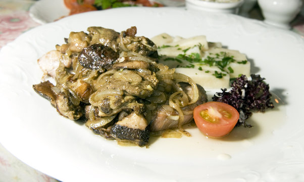 pork sirloin stewed with local seasonal mushrooms  onions Polish