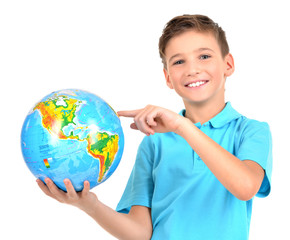 Smiling boy in casual  holding globe in hands