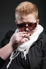 Chubby woman with short hair smoking cigarette